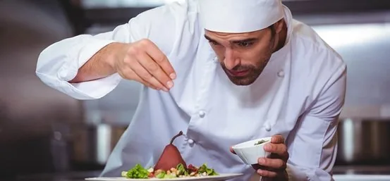 Private chef preparing a plated meal