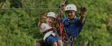 Guest ziplining through the Costa Rica rainforest