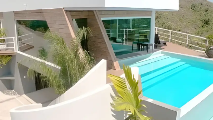 Private luxury pool area and exterior architecture of the Royale Amber vacation rental in Jaco, Costa Rica.