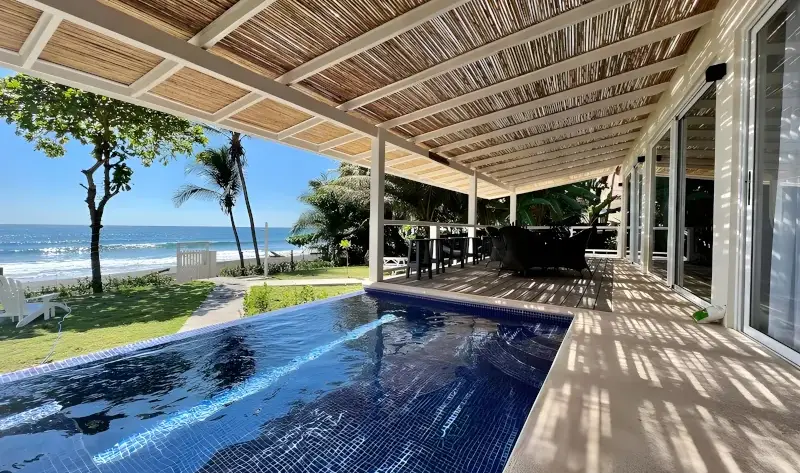 Modern 5-bedroom beachfront vacation rental Royale Blossom with direct access to Jaco Beach.