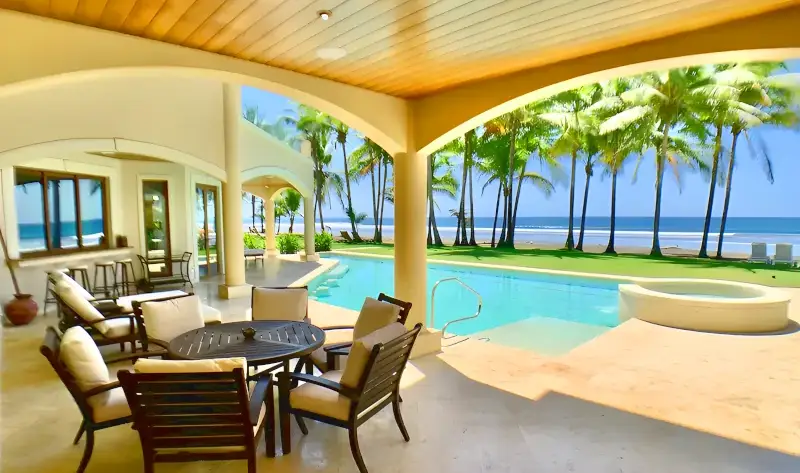 Main entrance and tropical exterior of the Royale Corvette luxury 5-bedroom vacation rental in Jaco, Costa Rica.